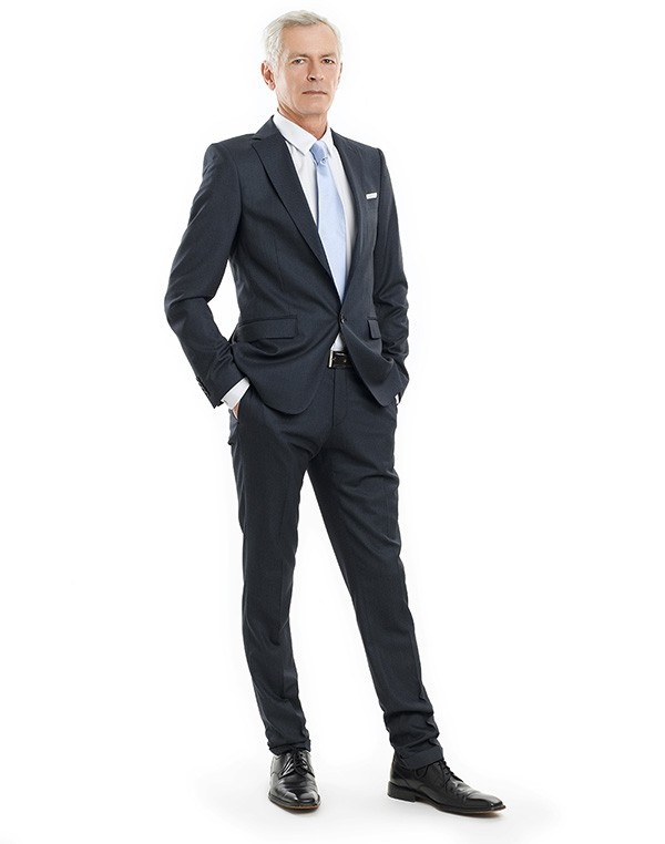 Businessman portrait Full-length portrait of a senior businessman standing against white background.